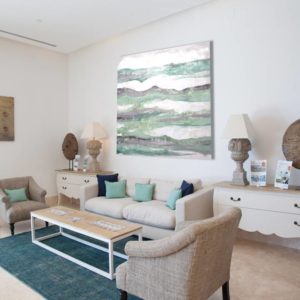 Ethereal white and grey abstract painting on a wall.