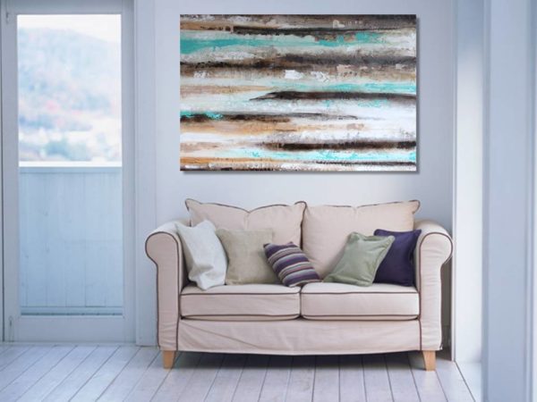 Turquoise painting with fish in a beach vibe bedroom decor.