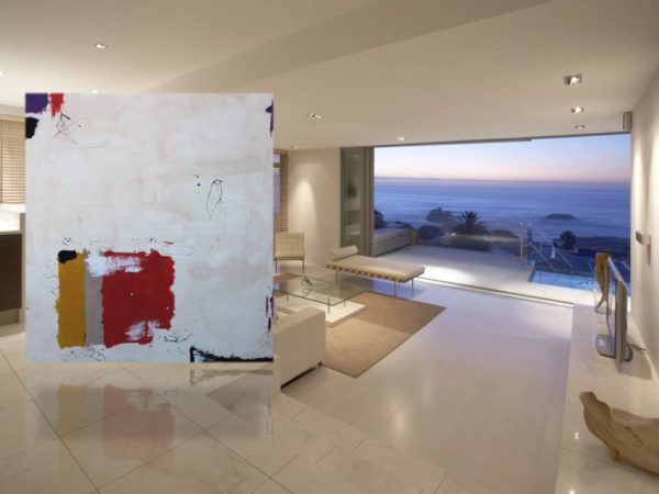 Red, grey, and black abstract painting in a modern loft setting.