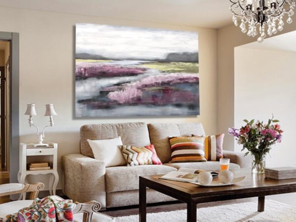 Bright living room with magenta abstract painting and cozy modern decor.
