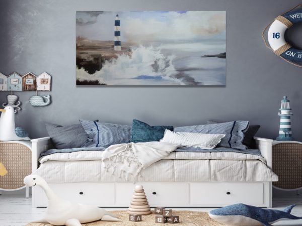 Cozy kids' room with a lighthouse painting above a white daybed.