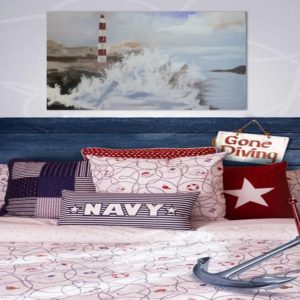 Nautical-themed bedroom with a lighthouse painting and "Gone Diving" sign.