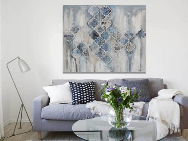 Ethereal white and grey abstract painting on a wall.