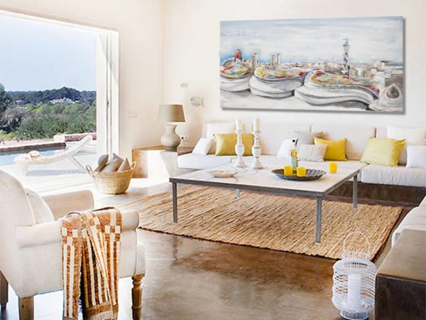 Large teal abstract art above a white sofa in a bright living room.