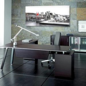 Modern executive desk in a home office setting.