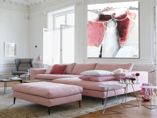 Bright living room with magenta abstract painting and cozy modern decor.
