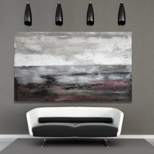 Gray abstract canvas art with hints of lilac above a modern sofa.