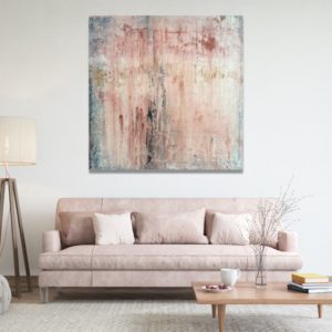Ethereal white and grey abstract painting on a wall.