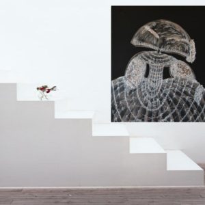 Silver and black painting in a modern living space.