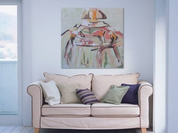 Modern living room with a white sectional and abstract teal art.