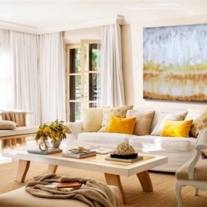 Bright abstract painting in a modern, light-filled living room.