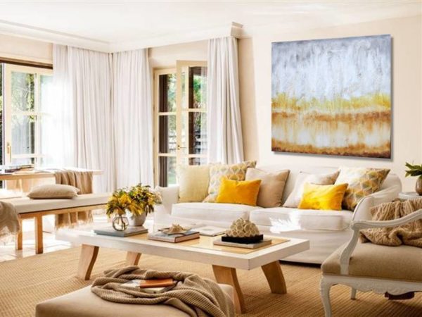 Bright abstract painting in a modern, light-filled living room.