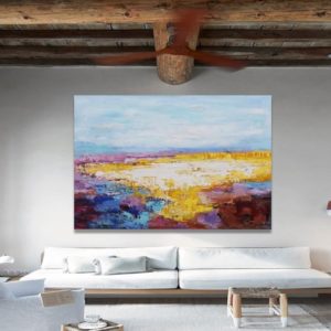 Bright living room with magenta abstract painting and cozy modern decor.