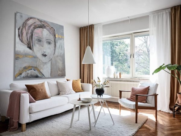 Figurative portrait painting in a black and white room.