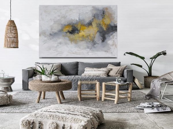 Abstract painting in a Greek-style outdoor dining area.