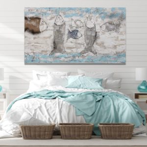 Turquoise painting with fish in a beach vibe bedroom decor.