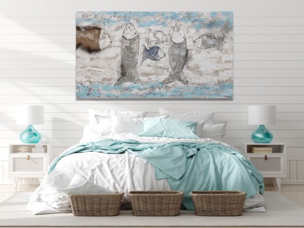 Turquoise painting with fish in a beach vibe bedroom decor.