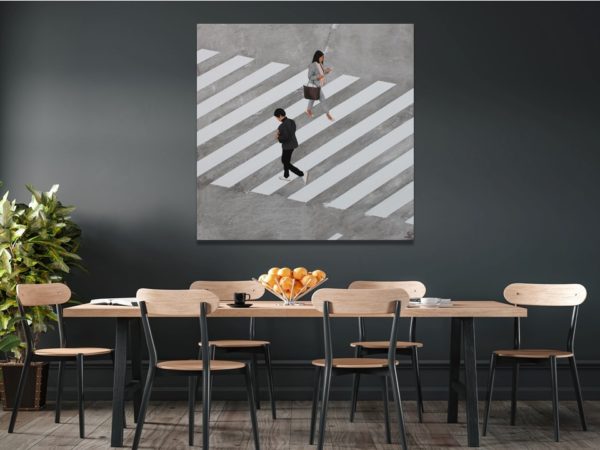 Aerial view painting of people on a zebra crossing above a dining table.
