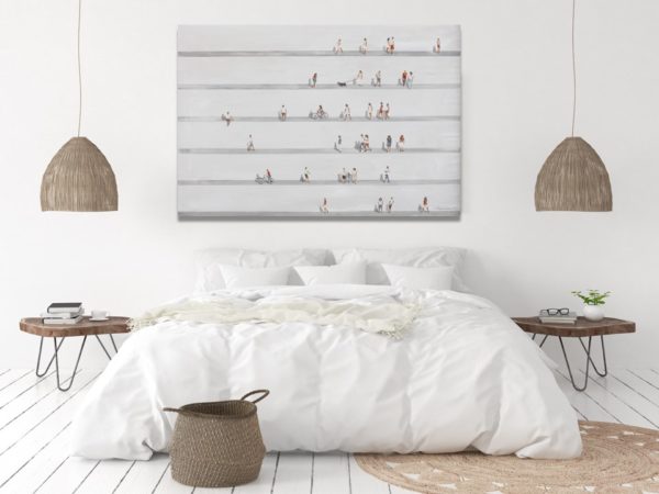 Modern minimalist wall art with figures in a bedroom.