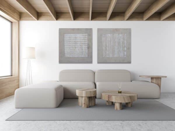 Minimalist hand-painted abstract art in a modern living room setup.